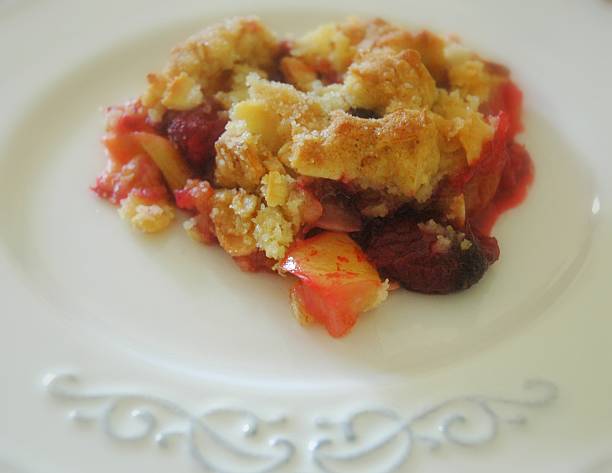 Apple and damson crumble stock photo