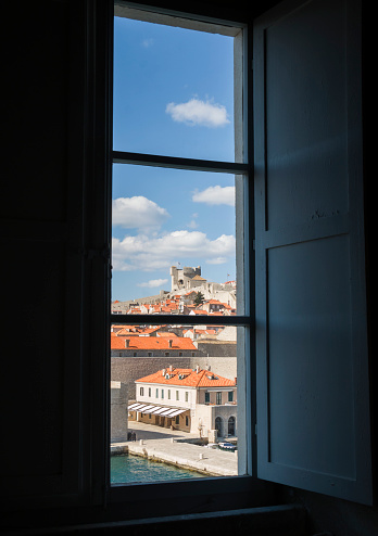 View through a window on the Old city harbor Dubrovnik