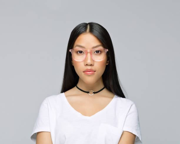 istock Serious woman against gray background 1396928770