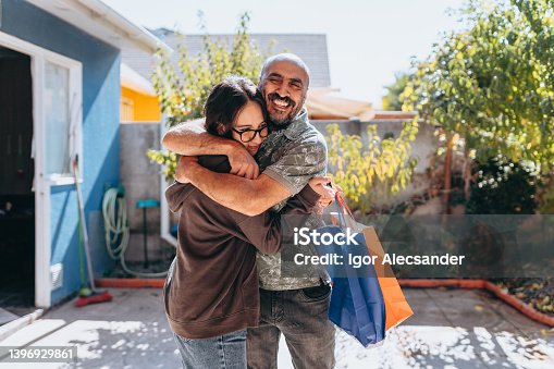 istock Father and daughter hugging 1396929861