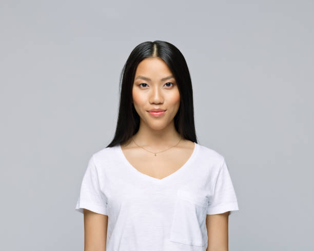 istock Young woman against gray background 1396930792