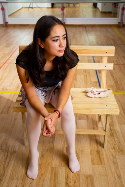 Woman concentrating before her ballet training.