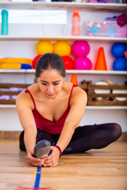 istock Woman preparing to practice ballet. 1396931611