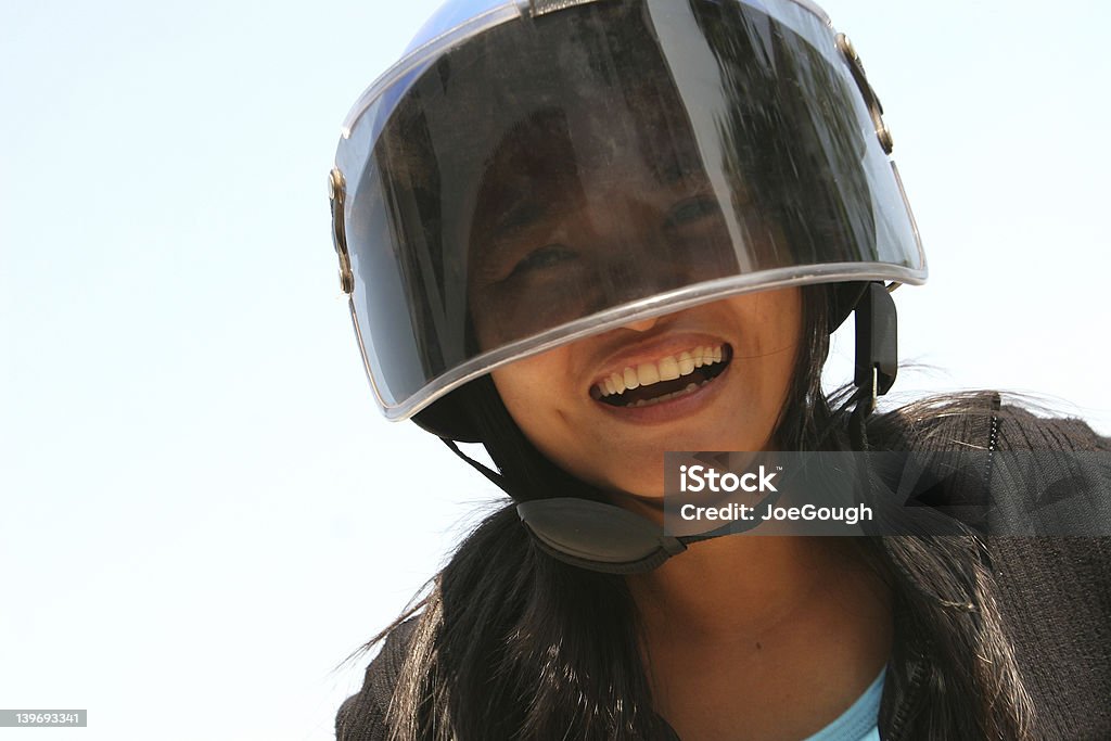 Happy Biker Smiling female motorcyclist wearing helmet Helmet Visor Stock Photo