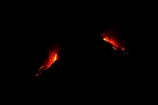 Close-up of flames against black background.