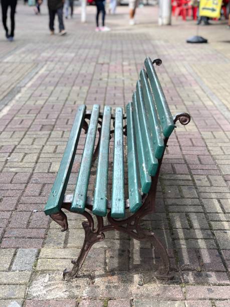 istock Green wood and metal bench. 1396939411