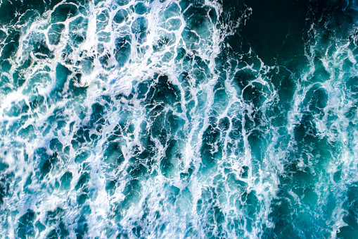 Top down view of rippling turquoise ocean water