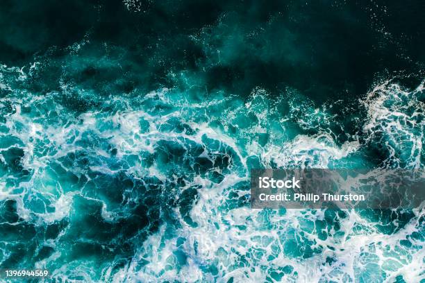 Turquoise Ocean Waters Stock Photo - Download Image Now - Sea, Sea Foam, Teal