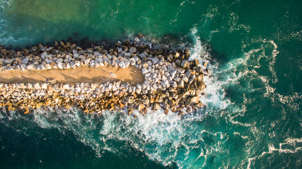 istock Rock jetty in turquoise ocean water 1396944620