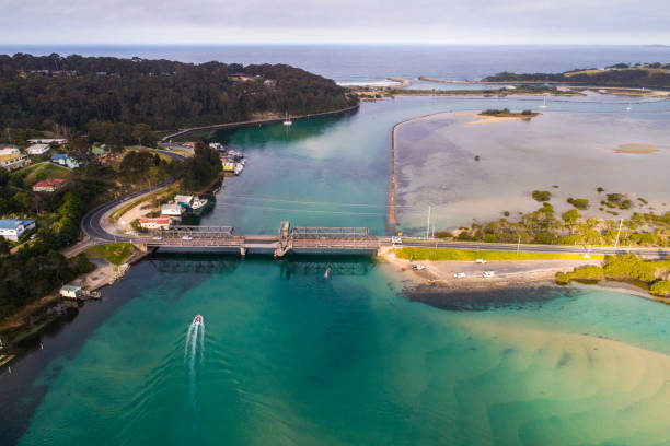 istock Drone view of boat heading toward harbor bridge 1396944681