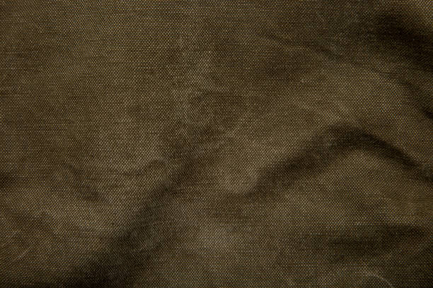 istock Closeup texture of canvas fabric. Khaki fabric background. 1396945248