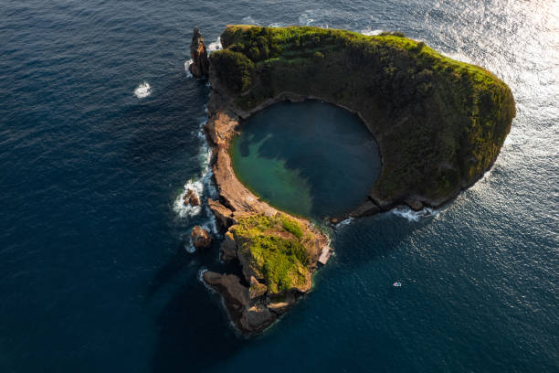 istock Small island with lake in ocean 1396946147