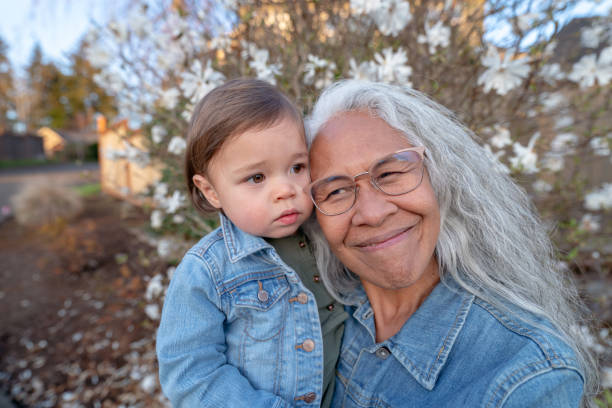 istock Affectionate grandma embracing her granddaughter 1396946285