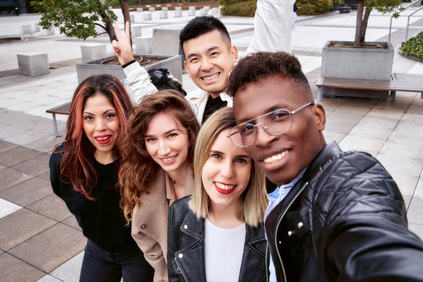 istock Diverse friends taking selfie together 1396951569
