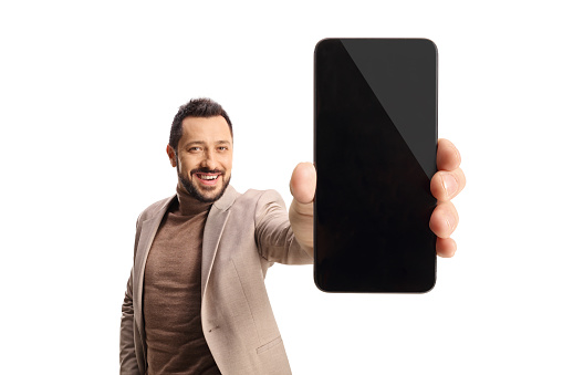 Smiling man showing a blank screen of a smartphone in front of camera isolated on white background