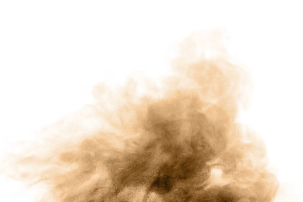 istock Brown black dust powder explosion. The texture is abstract and splashes float. 1396954992