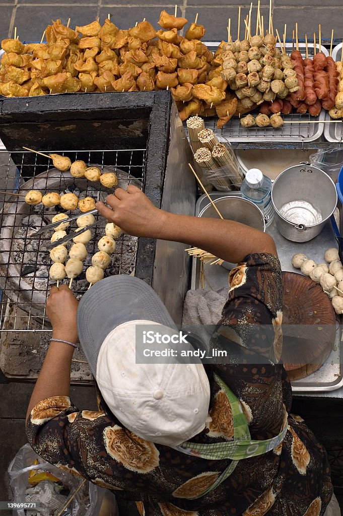 Street hawker selling skewered fish balls, pork balls etc in Bangkok, Thailand Bangkok Stock Photo