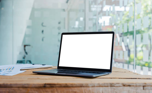istock Laptop with blank white screen on wooden table for montage your ads. 1396960629