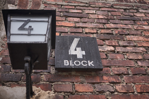 Oswiecim, Poland - March 31, 2014 : Close-up of building sign 4 block in the former Nazi concentration camp Auschwitz-Birkenau
