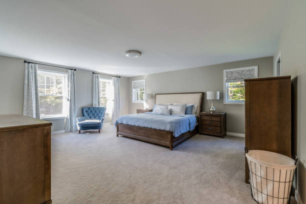 istock Huge bedroom with wood bed frame 1396961698