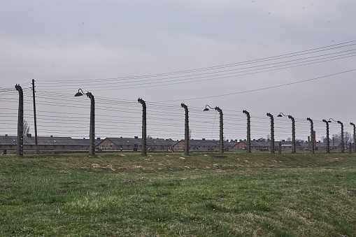 Oswiecim, Poland - August 25, 2013: Gates to Auschwitz Birkenau Concentration Camp, a former Nazi extermination camp on August 25, 2013 in Oswiecim, Poland