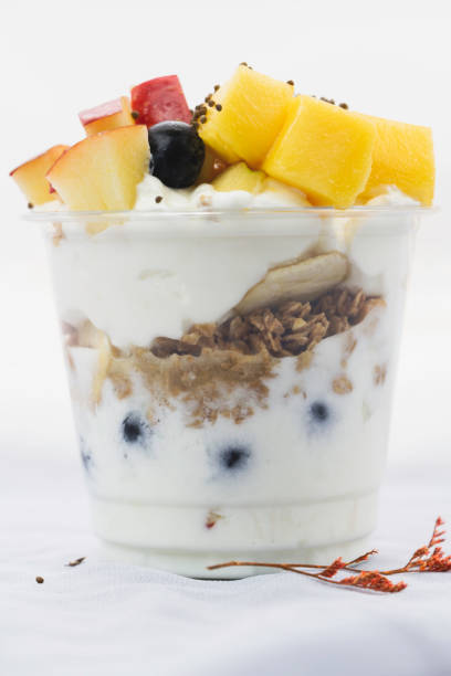 Top view of Mixed fruit Yoghurt,healthy diet food,put on background,blurry light around