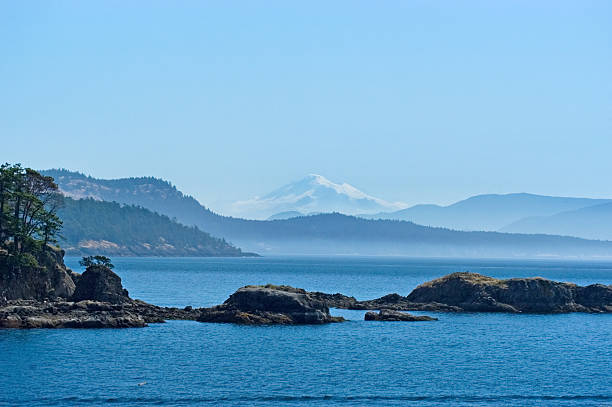 San Juan islands in the distance San Juan islands with Mt. Baker on background mt baker stock pictures, royalty-free photos & images