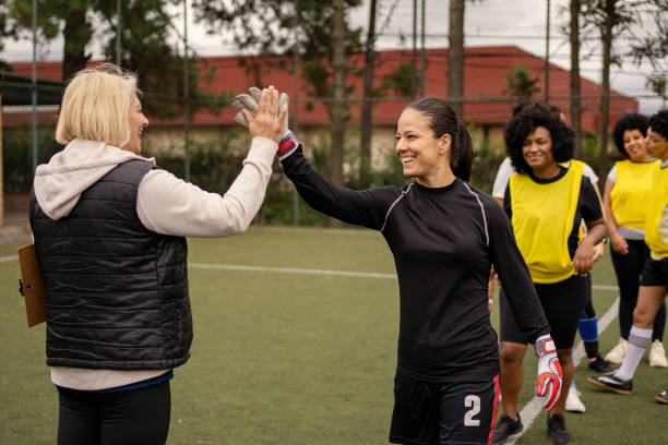 istock Women's soccer team greeting before the game 1396966746