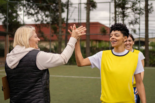 istock Women's soccer team greeting before the game 1396966754