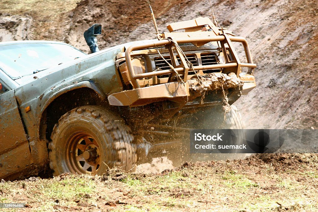 Off roading action 2 Four wheel vehicle coming out of the water hazard, steam and mud spraying out. (MOTION BLUR)  4x4 Stock Photo