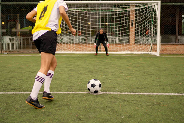 istock Female soccer player taking penalty 1396967370