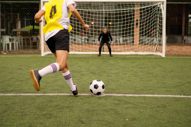 istock Female soccer player taking penalty 1396967372