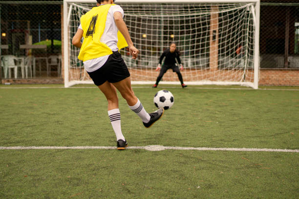 istock Female soccer player taking penalty 1396967379