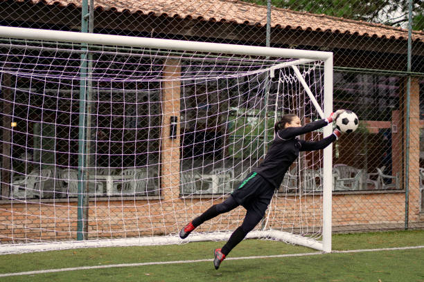 istock Female goalkeeper Catching the ball 1396967394