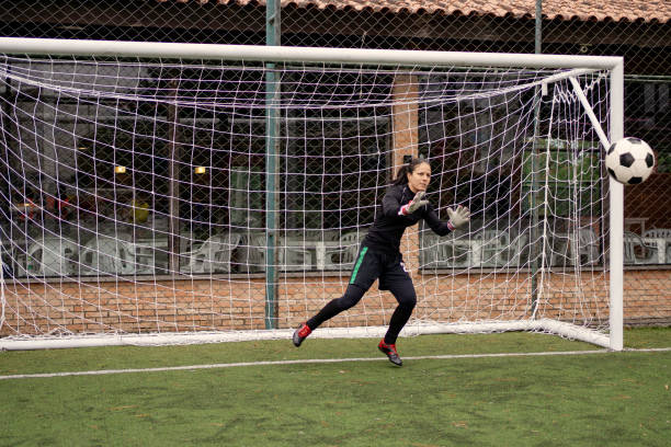 istock Female goalkeeper Catching the ball 1396967402