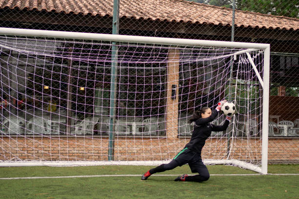 istock Female goalkeeper Catching the ball 1396967414