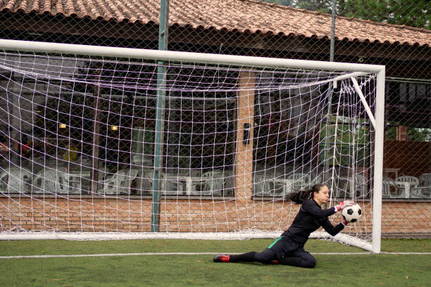 istock Female goalkeeper Catching the ball 1396967415