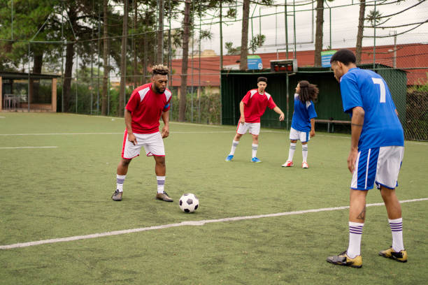 istock Friends playing soccer in the weekend 1396967559