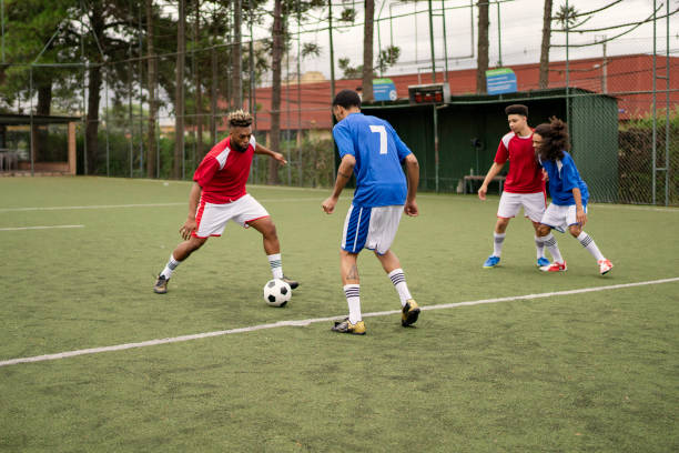 istock Friends playing soccer in the weekend 1396967569