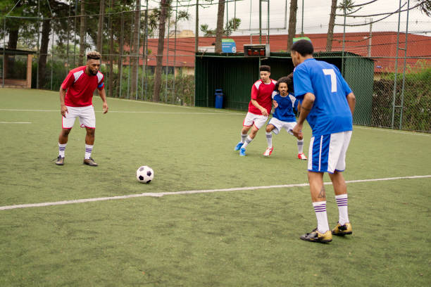 istock Friends playing soccer in the weekend 1396967572
