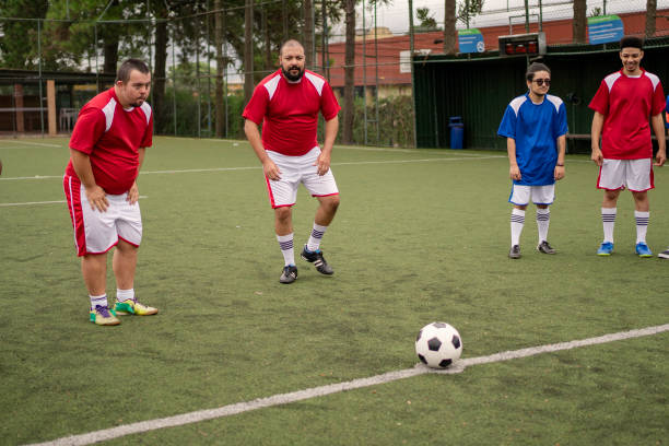 istock Soccer player with Down Syndrome getting ready to kick the ball 1396967608