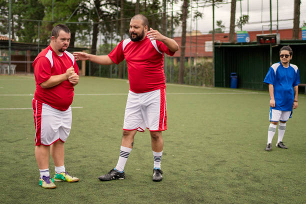 istock Soccer player with Down Syndrome getting ready to kick the ball 1396967609