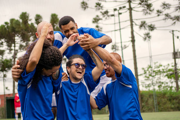 istock Transgender man celebrating scoring goal during soccer friendly game 1396967685
