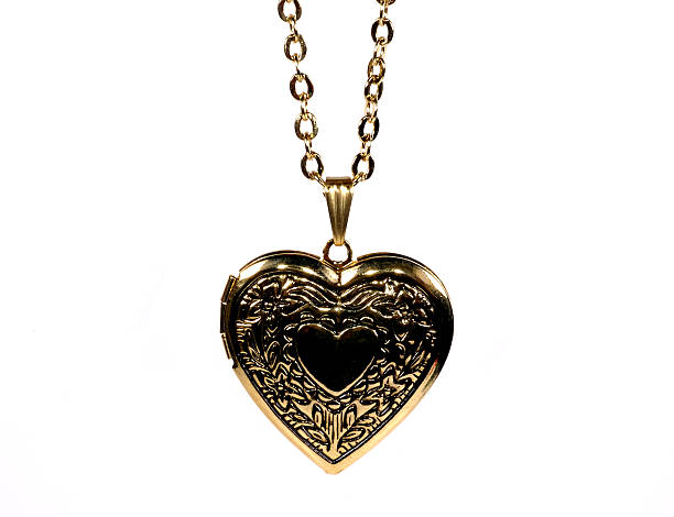 Heart Necklace Photo of a Gold Heart Shaped Locket locket photos stock pictures, royalty-free photos & images