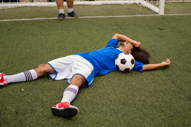 istock Soccer player down on the field 1396968773