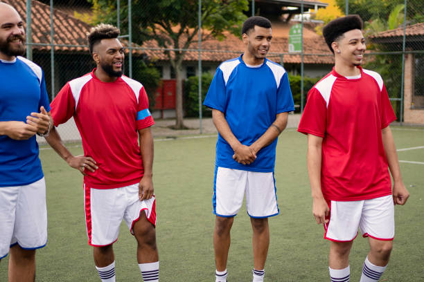 istock Group of soccer player friends talking before the game 1396968941