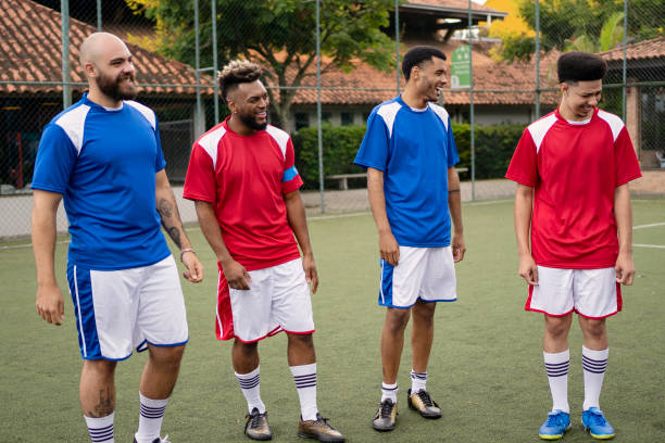 istock Group of soccer player friends talking before the game 1396968944