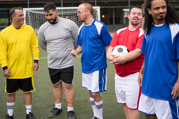 istock Group of soccer player friends talking before the game 1396968952