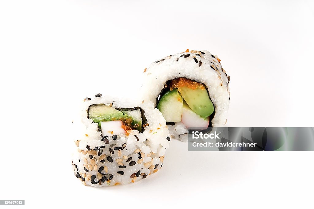 Sushi Two california sushi rolls isolated against a white background. Asia Stock Photo