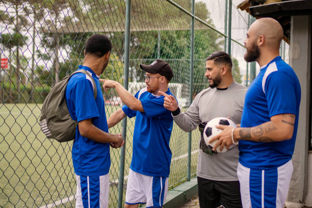 istock Men's soccer team talking before playing soccer 1396970190